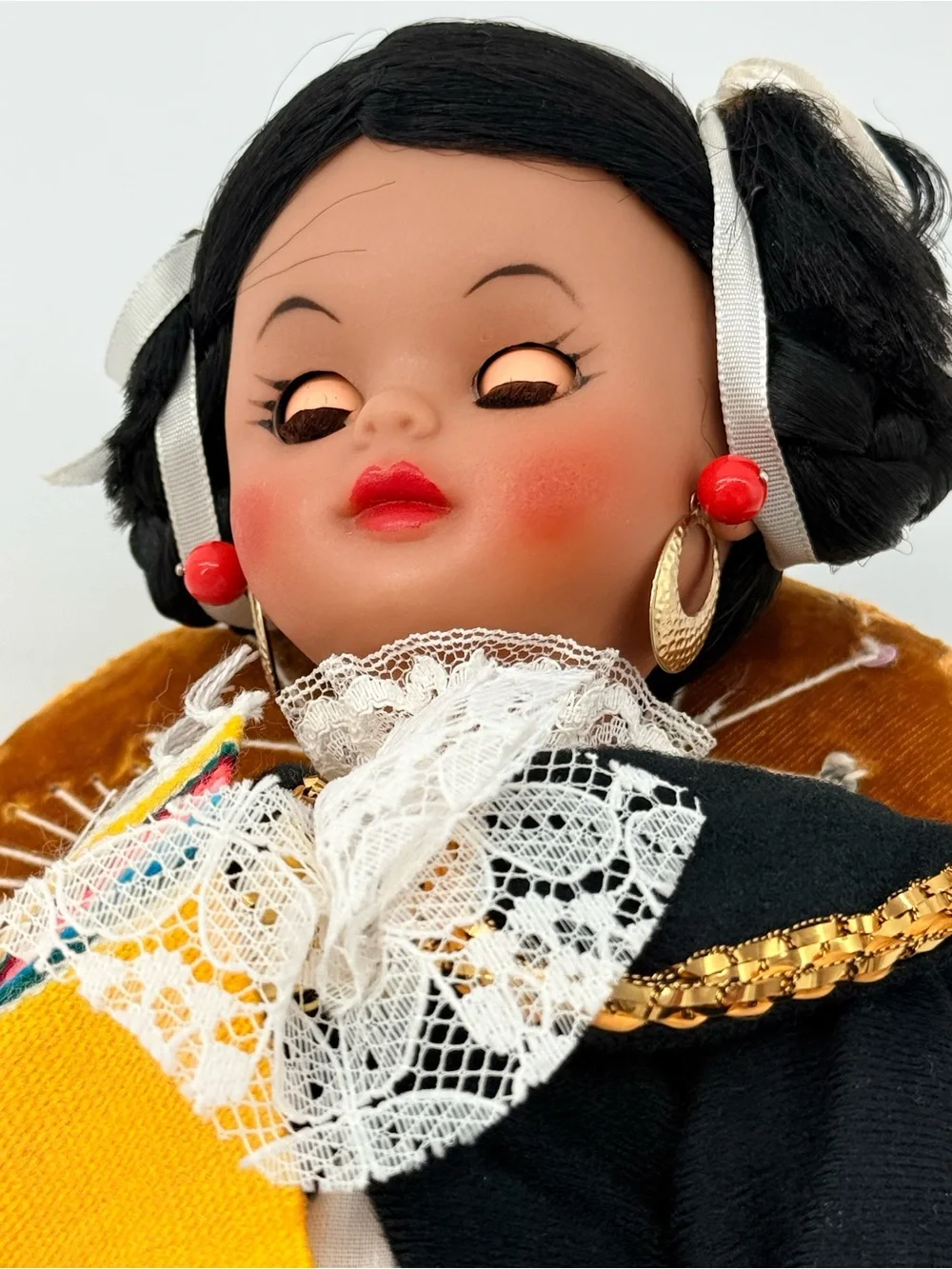 Traditional Black Cloth Doll with Yellow Sash and Lace Accents